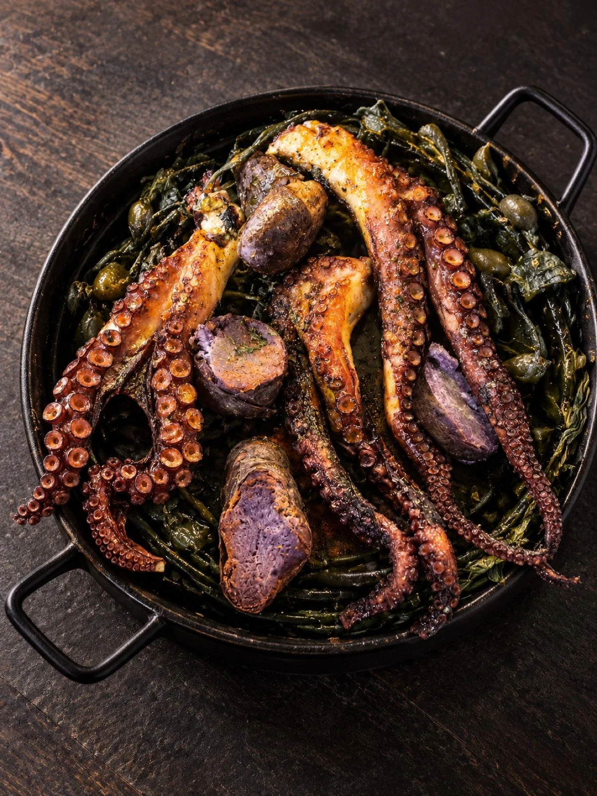 Charcoal-grilled Magellanic octopus with seaweed from the Strait and purple potatoes
